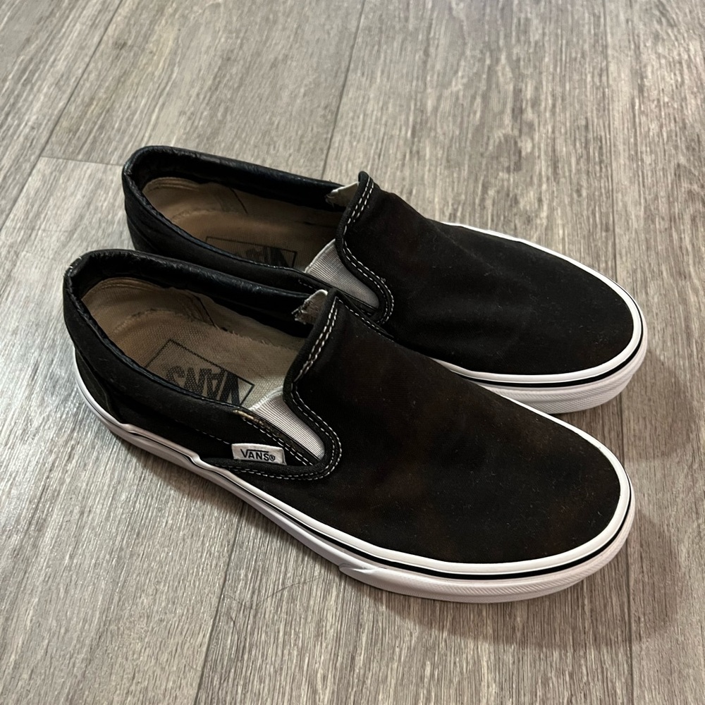 Black and white slip on vans